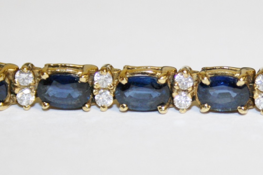 Sapphire & diamond tennis bracelet set in 18ct white gold, 22