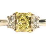 Martin Flyer Rectangular Modified Brilliant Cut Fancy Yellow Diamond Three Stone Ring- 1.06 ct.